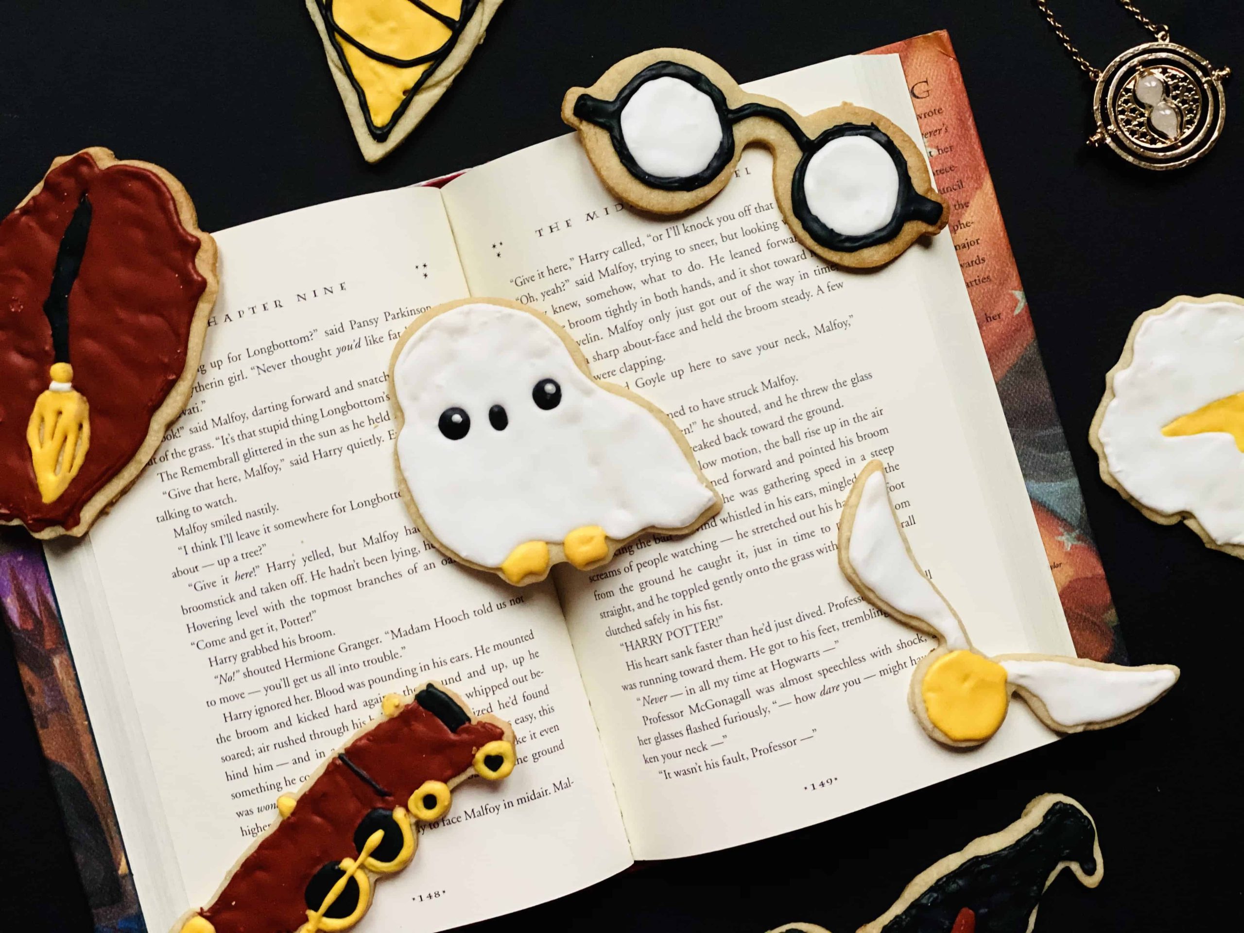 Sugar cookies laid out on an open book.