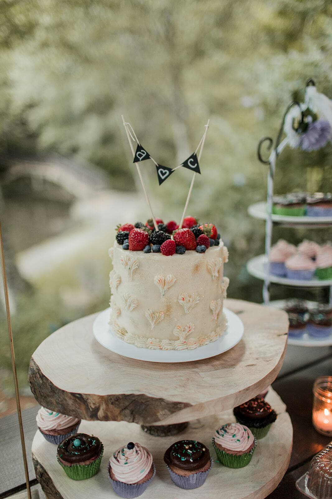 A wedding cake with a paper banner as the wedding cake topper.