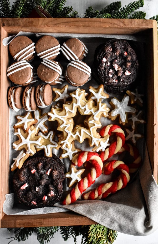 a wooden box full of Christmas cookies