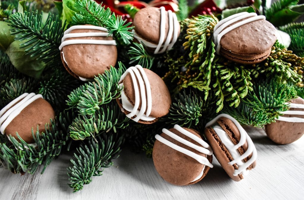 hot chocolate macarons hung inside a Christmas wreath