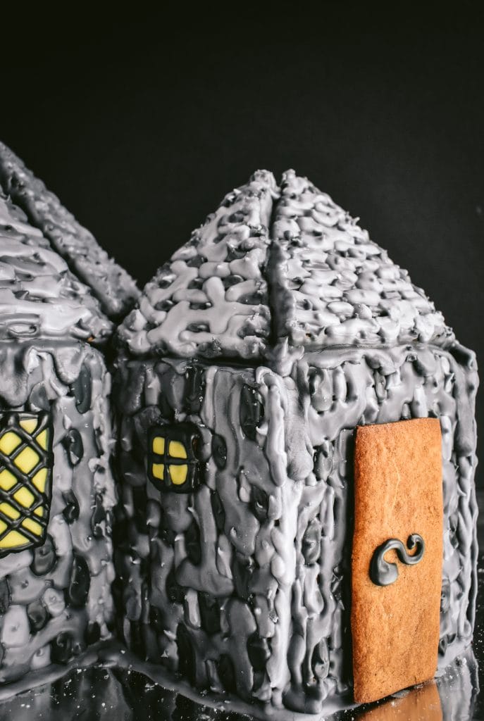 close up of windows and a door on a homemade Hagrid's Hut Gingerbread House