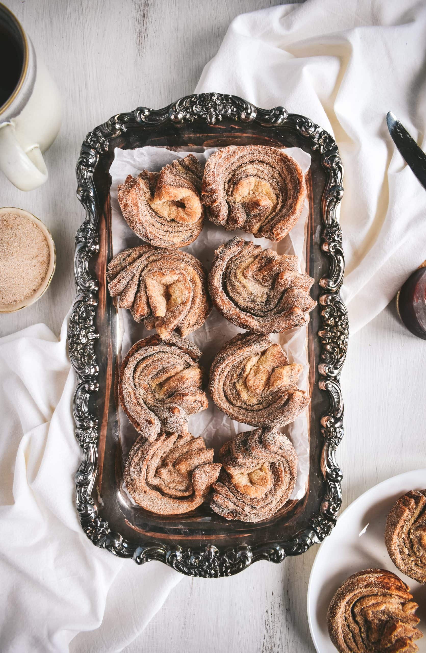 Homemade cruffins on an antique silver serving tray.