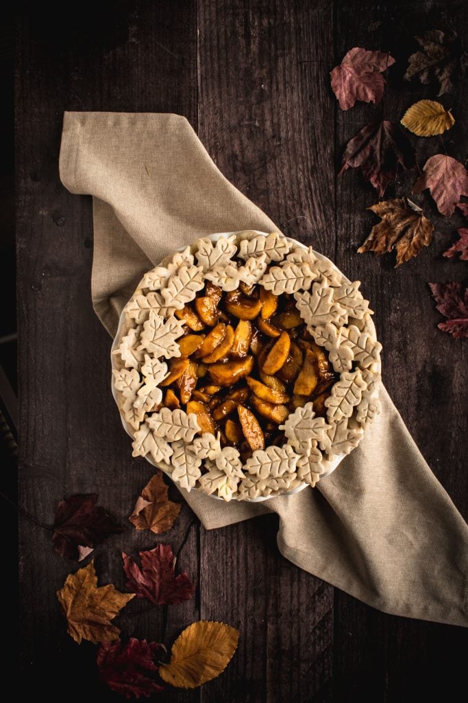 a whole unbaked Apple Pie from Scratch decorated with leaf pie dough cut-outs