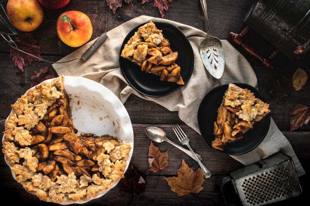 two slices of German Apple Pie from Scratch on small black plates