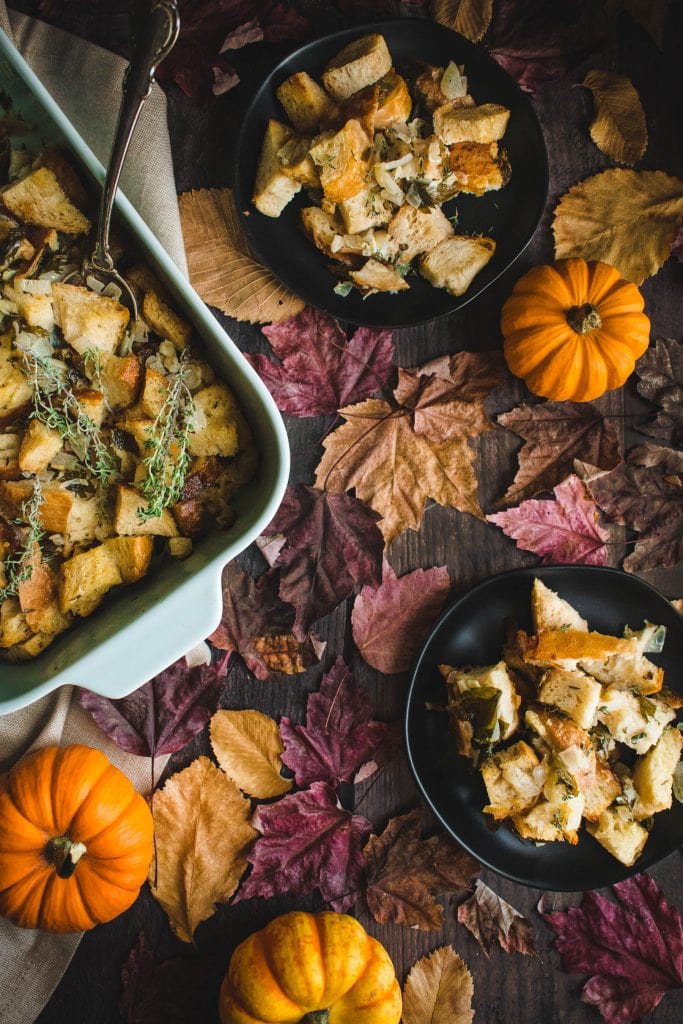 two black plates with a Thanksgiving side dish