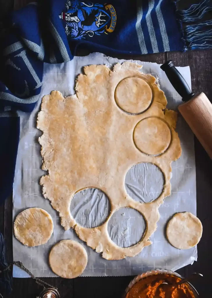 Pie dough rolled out and cut into small circles.