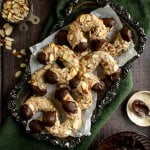 German almond horn cookies on a metal serving platter.