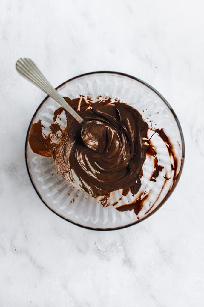 Melted chocolate in a glass bowl.