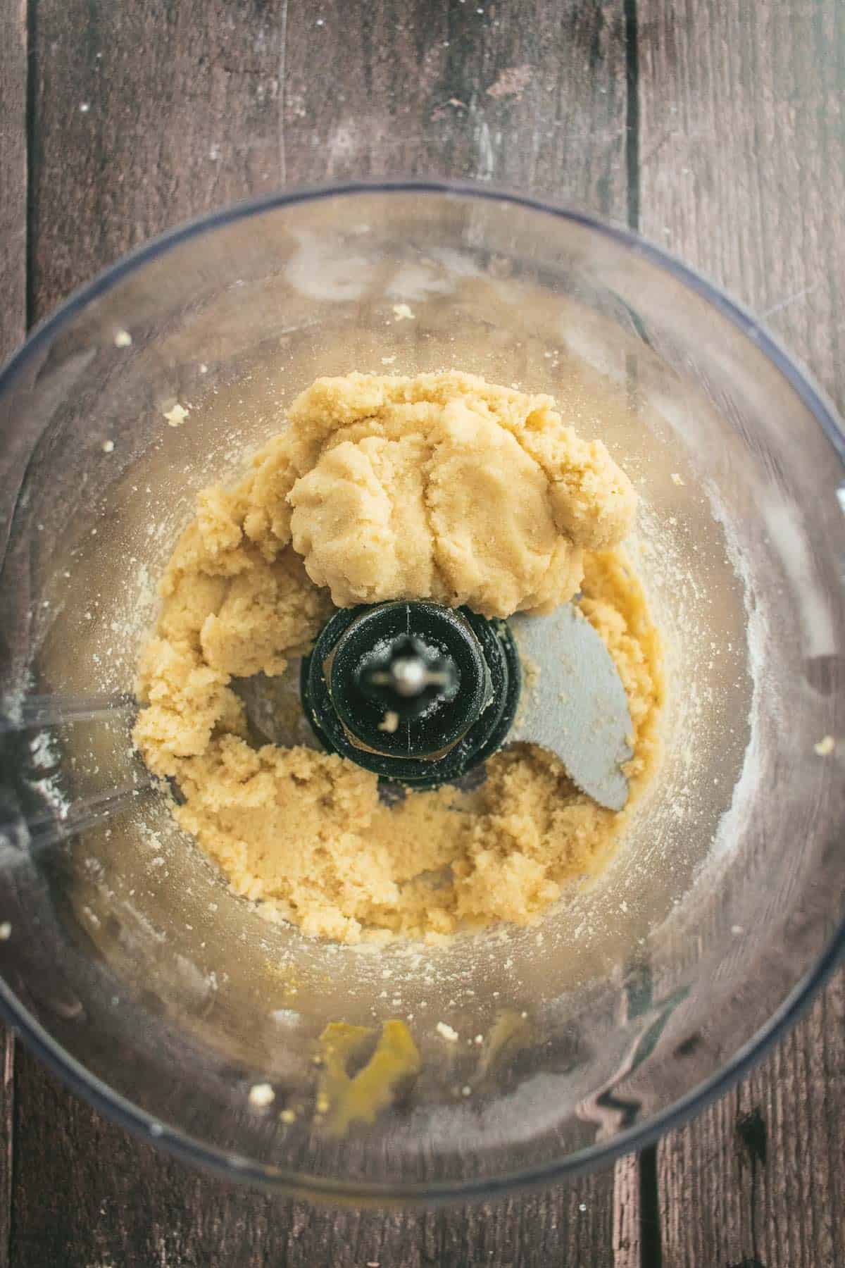 Homemade sticky marzipan in a food processor.