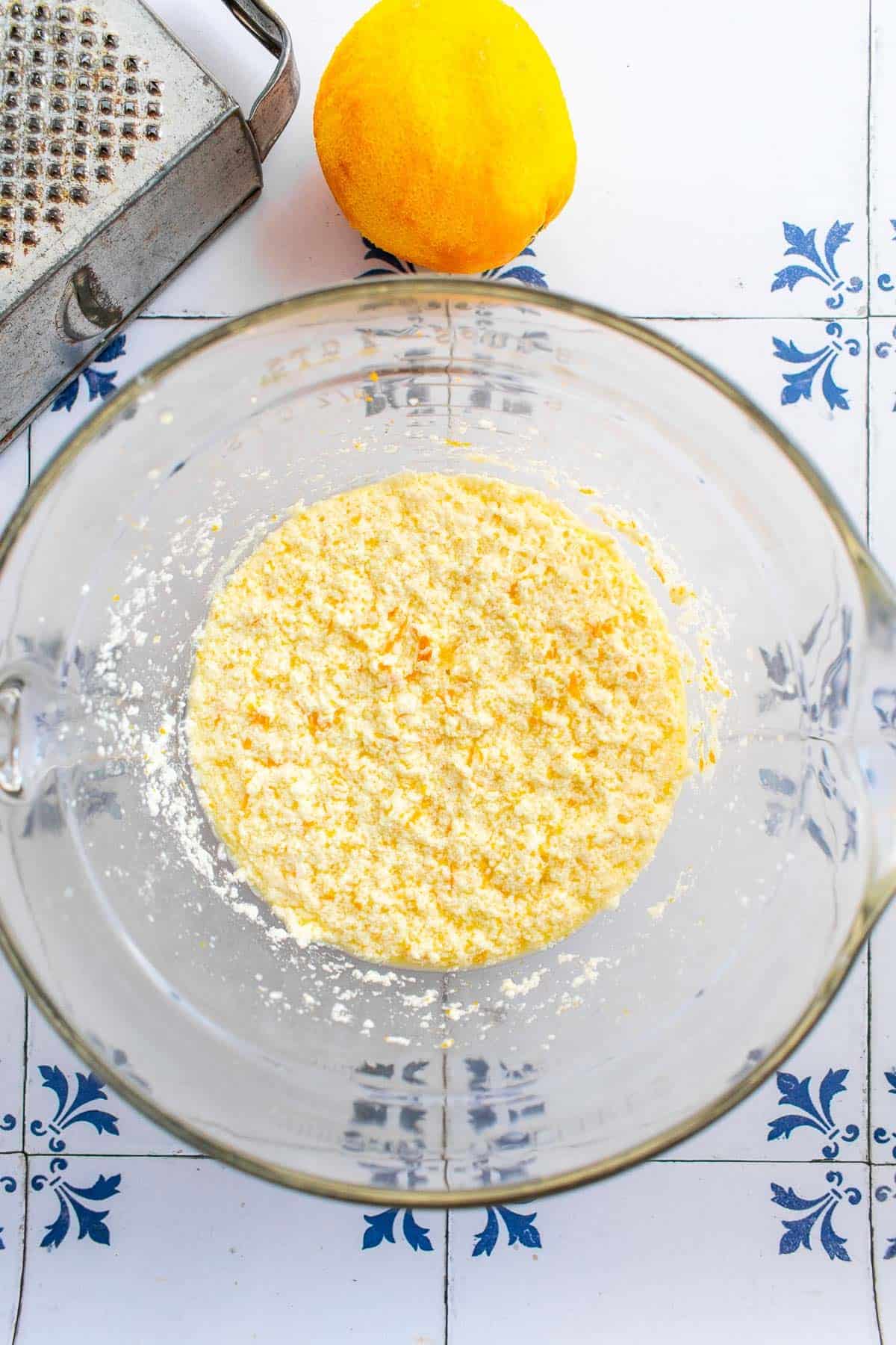 A curdled yellow mixture in a mixing bowl. 