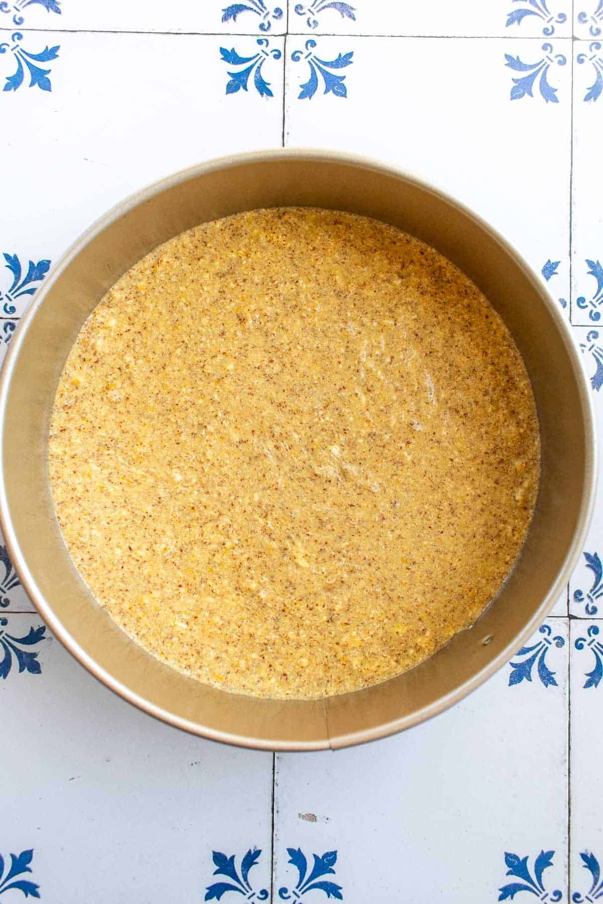 Almond flour cake batter in a springform pan. 