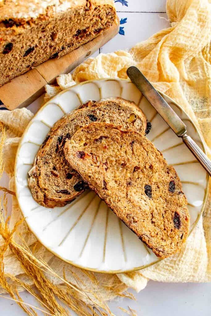Two slices of cranberry bread on a plate.