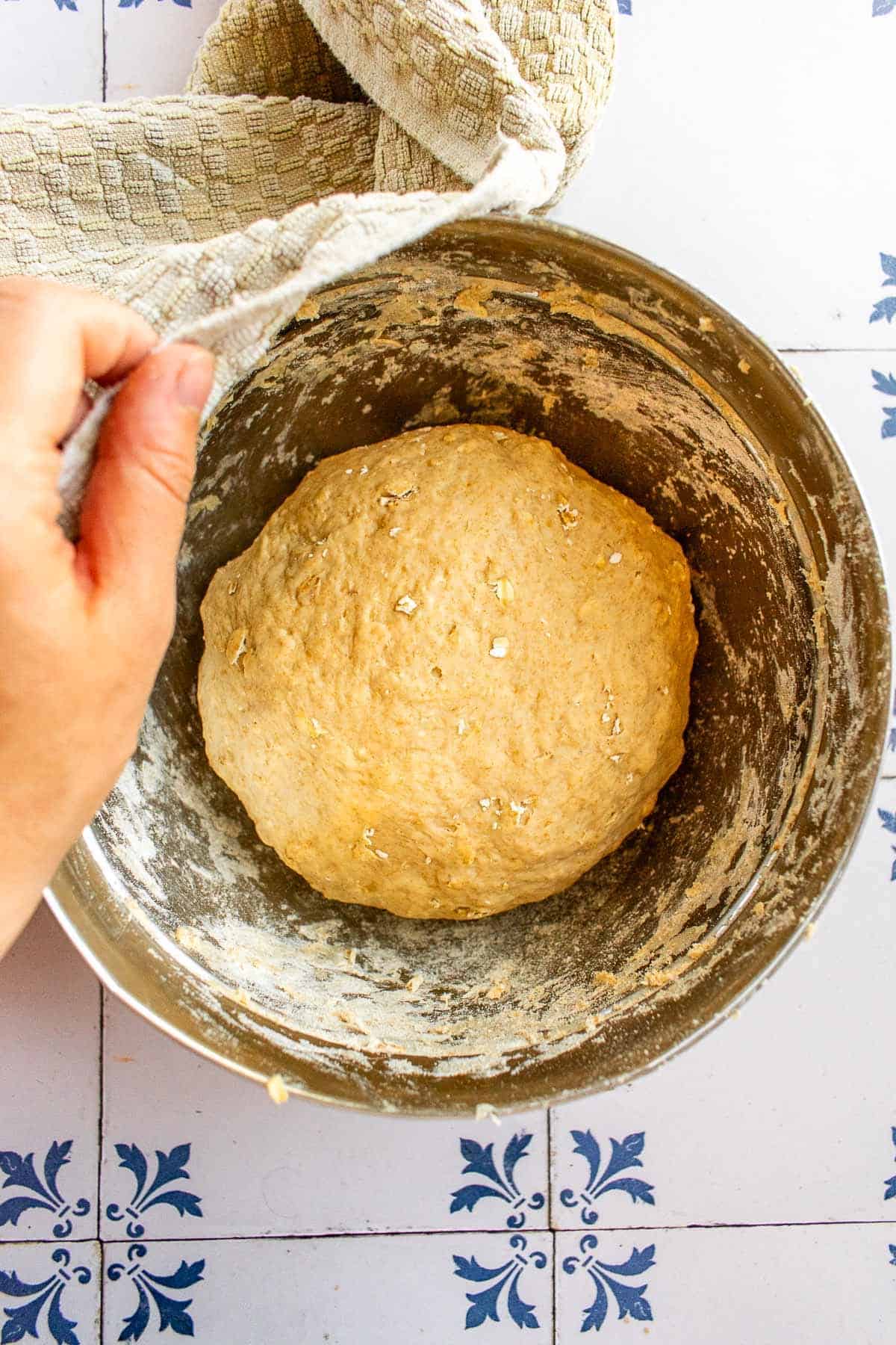 A ball of risen bread dough in a mixing.