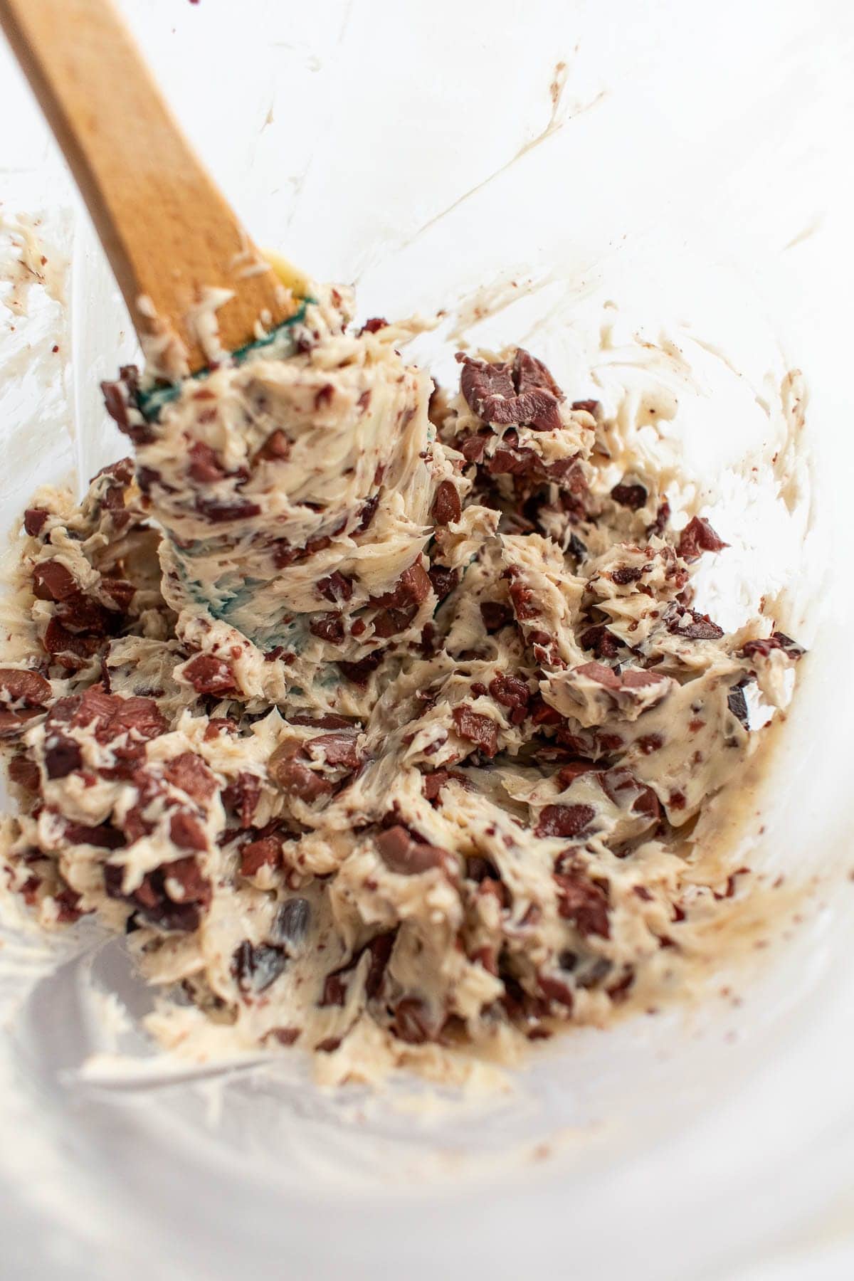 Creamy olive compound butter in a mixing bowl. 