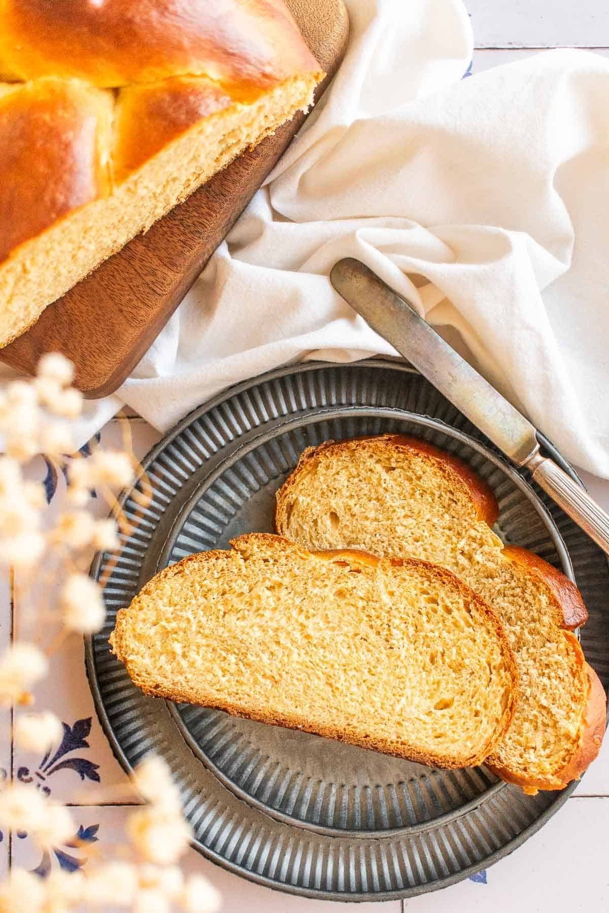 Two slices of sweet yeast bread on a metal plate.