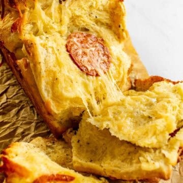 Melted cheese and pepperoni in between slices of baked bread.
