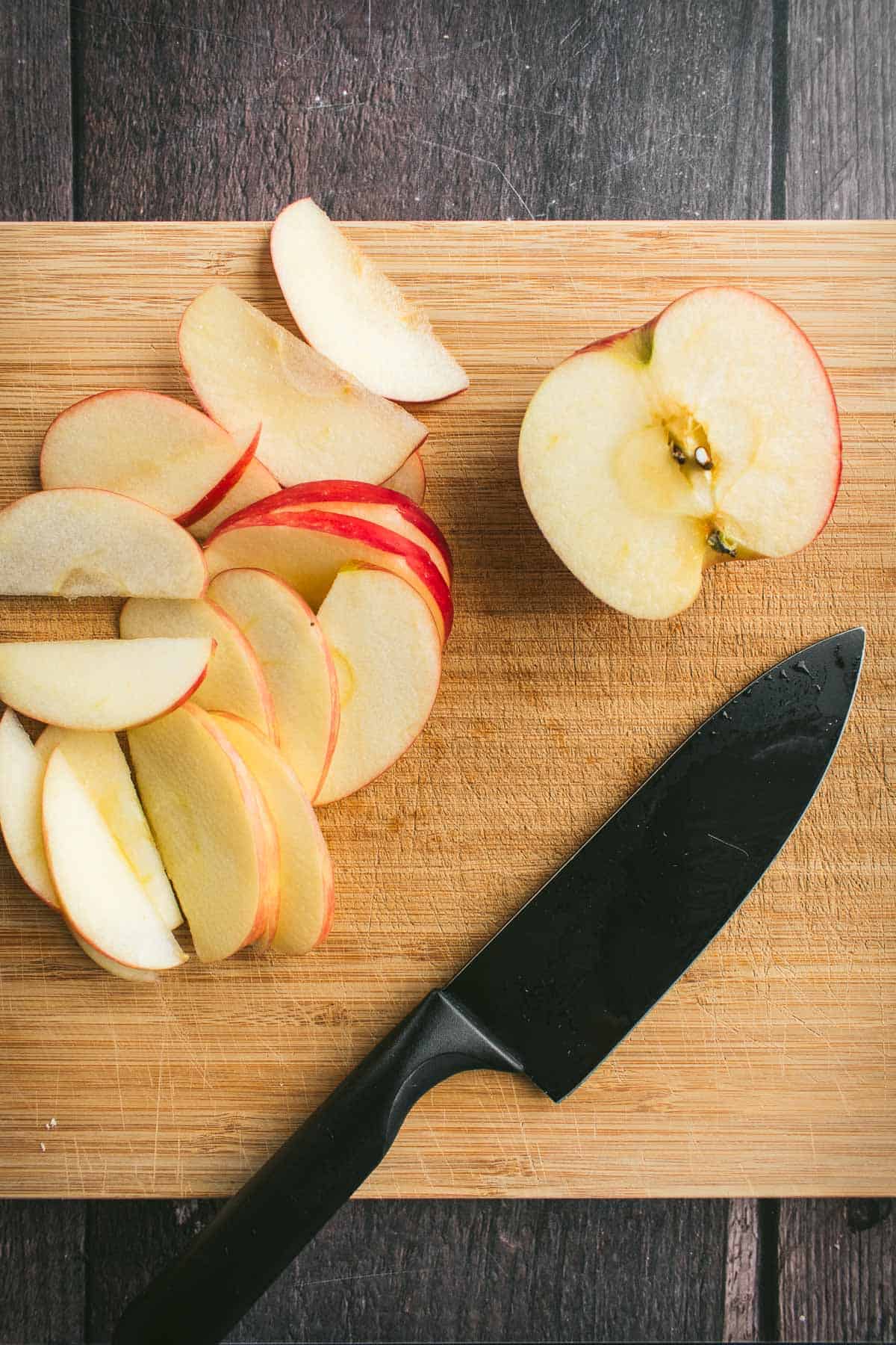 Sliced apples on a cutting board.