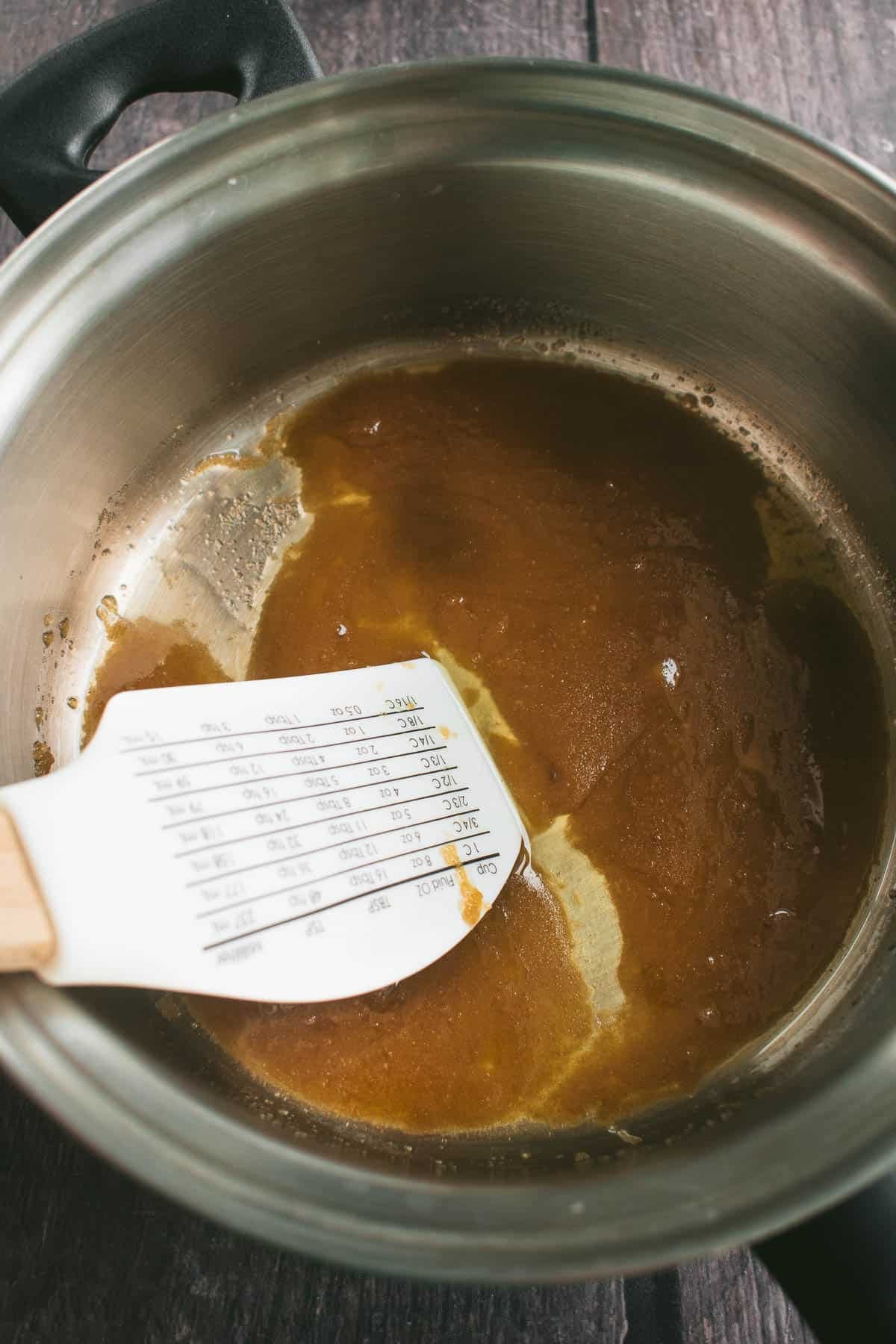 Brown sugar and butter cooked in a saucepan.
