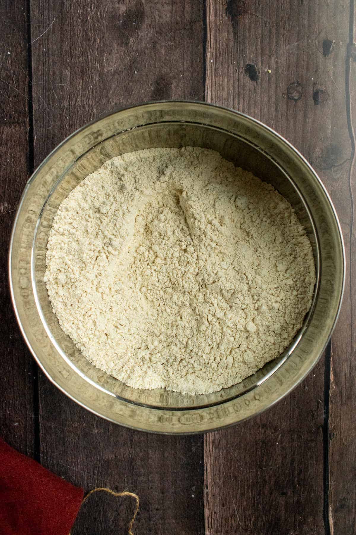 Flour, salt, and cinnamon whisked in a bowl.