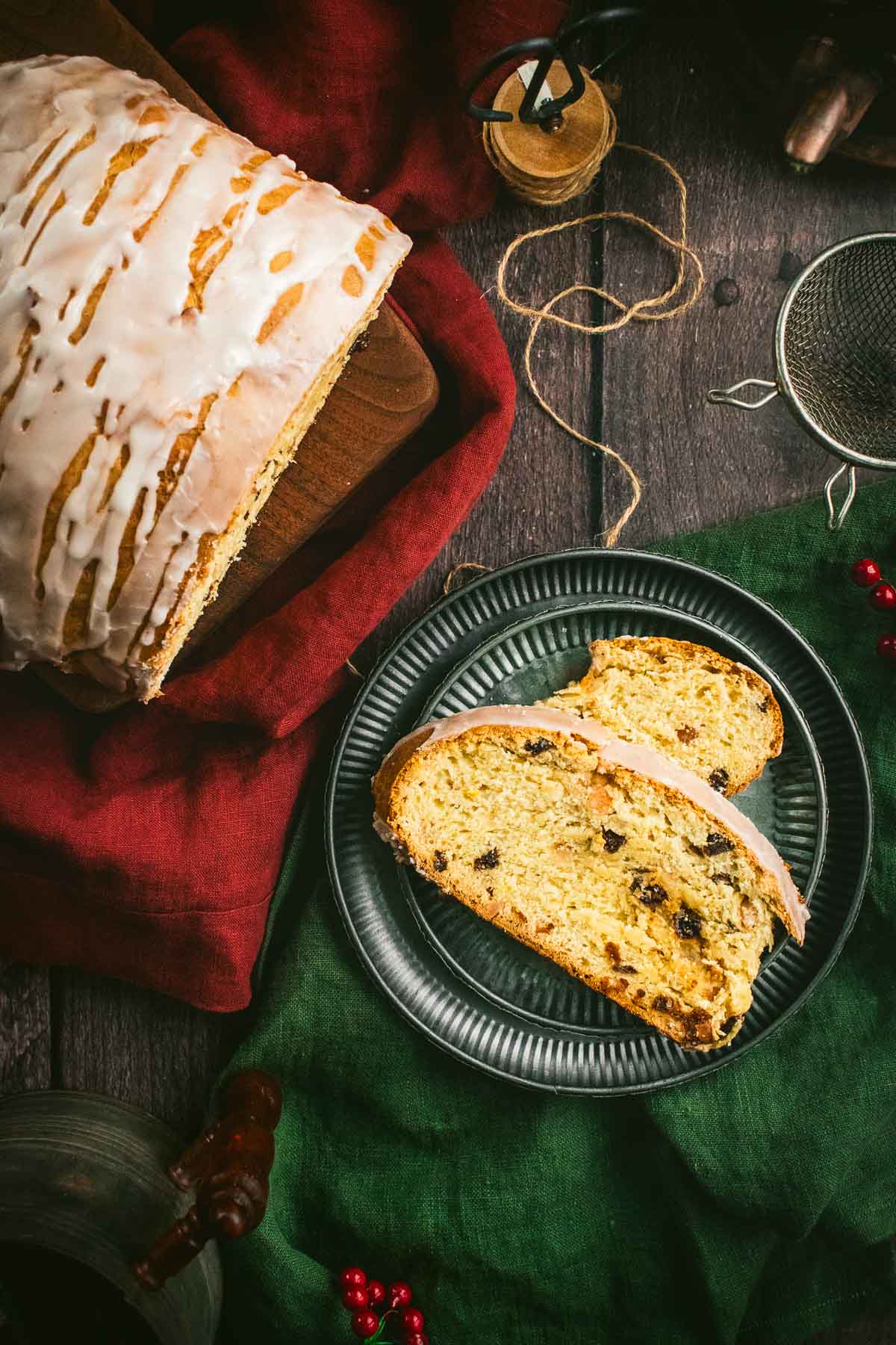 Two slices of stollen bread on a metal plate.