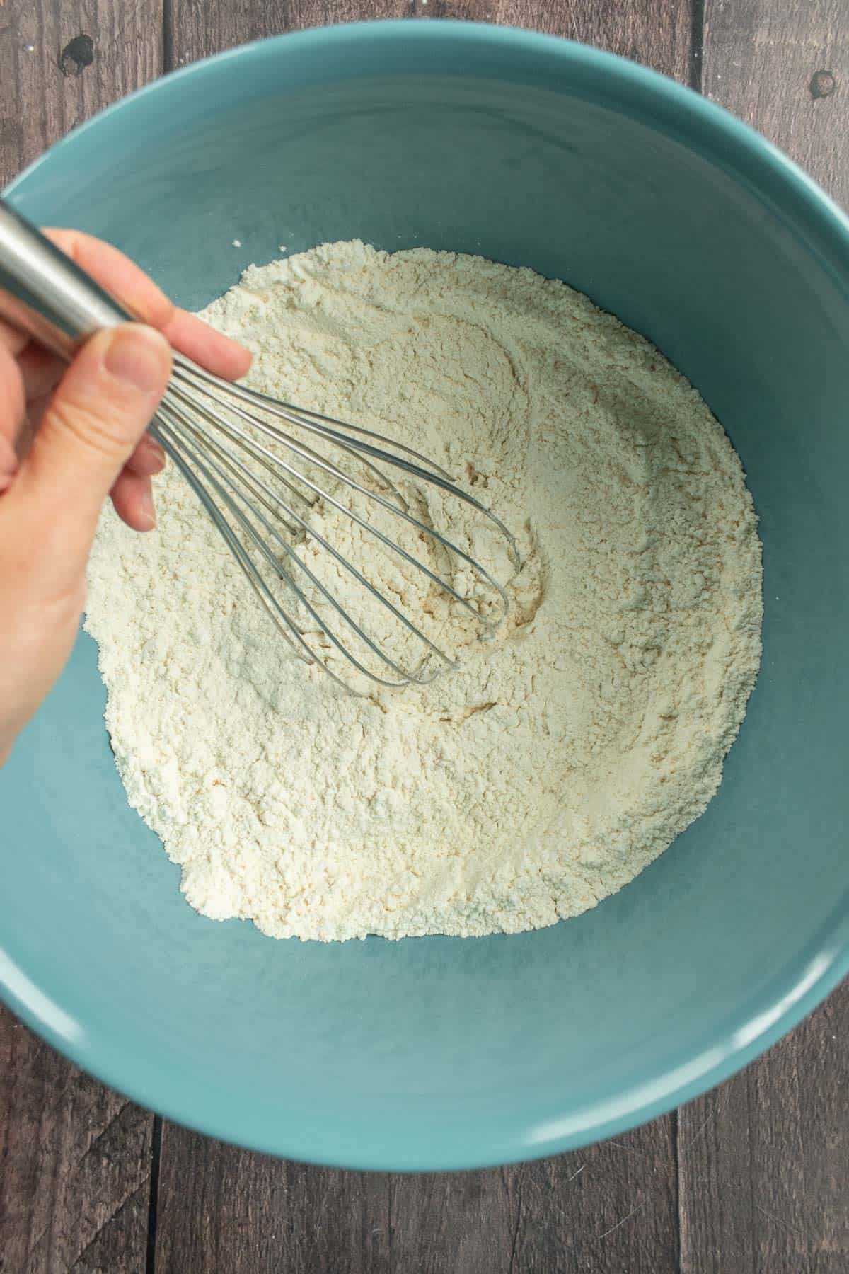 Flour, salt, and yeast whisked in a bowl.