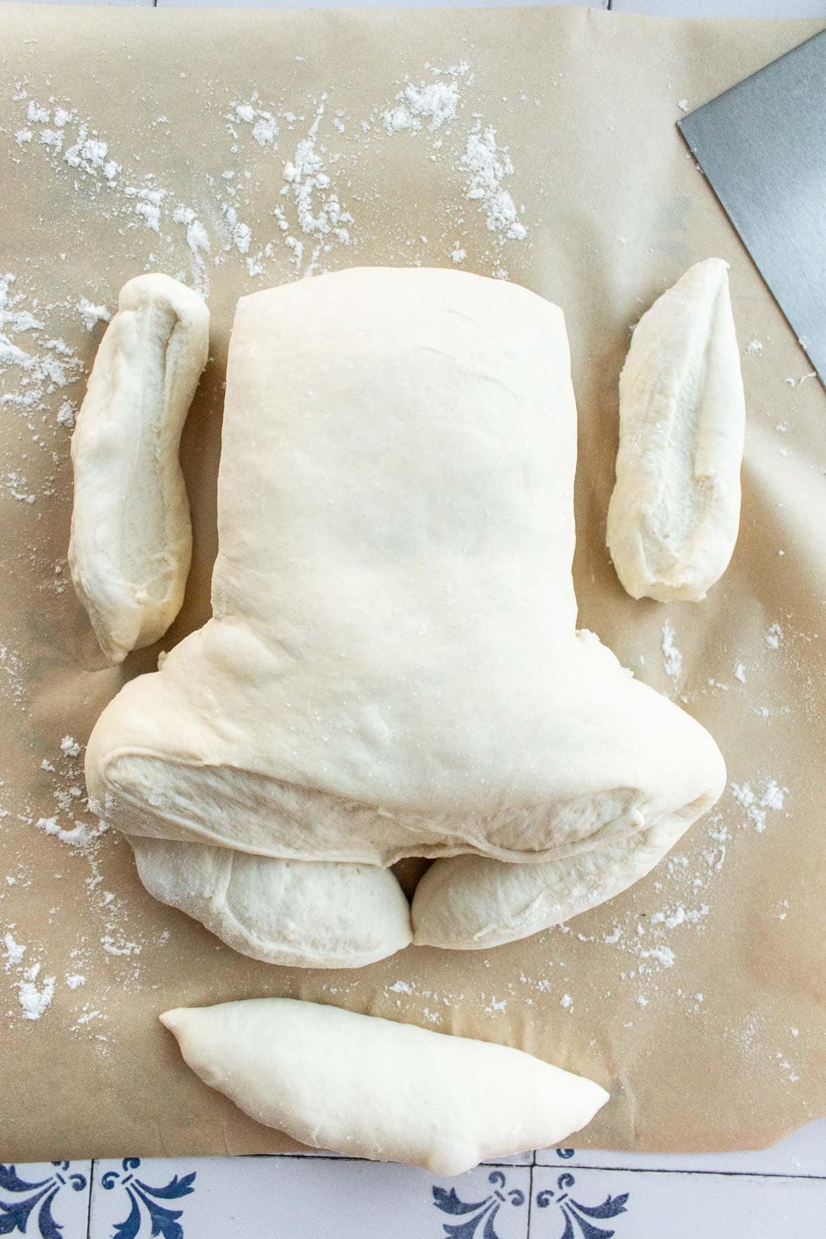 Bread dough being shaped into a bunny.