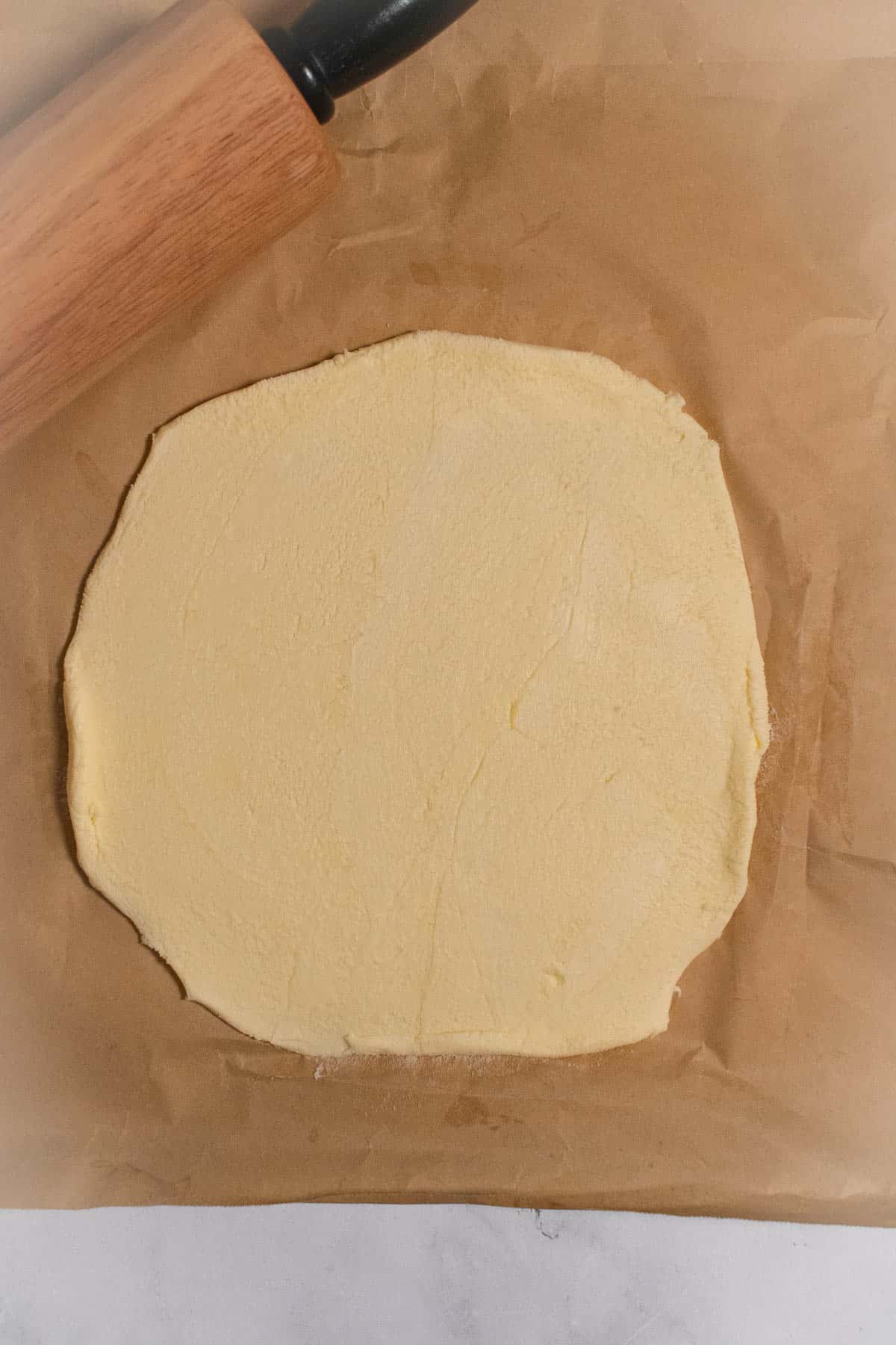 A butter block on parchment paper.