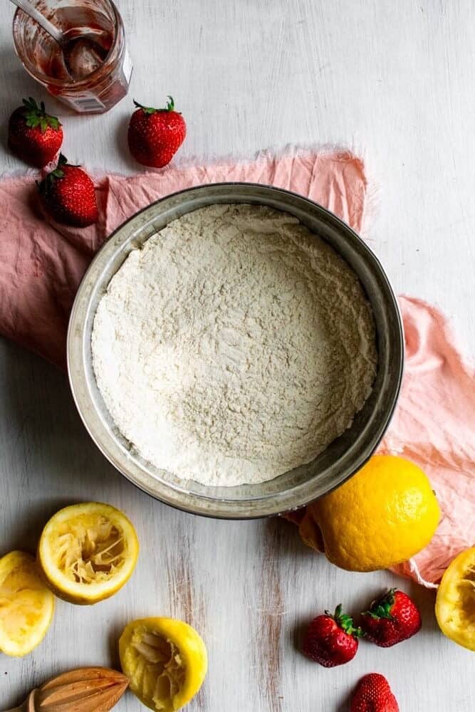a metal bowl with flour inside.