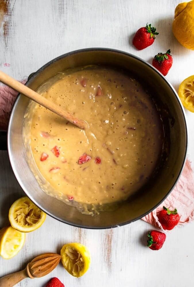 a metal bowl filled with Strawberry Lemon Cake batter.