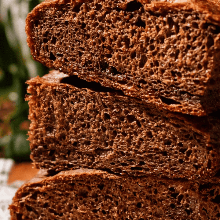 A stack of three thick, airy pieces of chocolate focaccia bread.